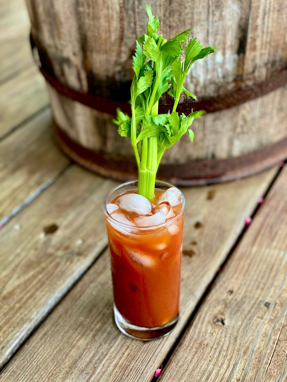 bloody mary cocktail with celery on deck