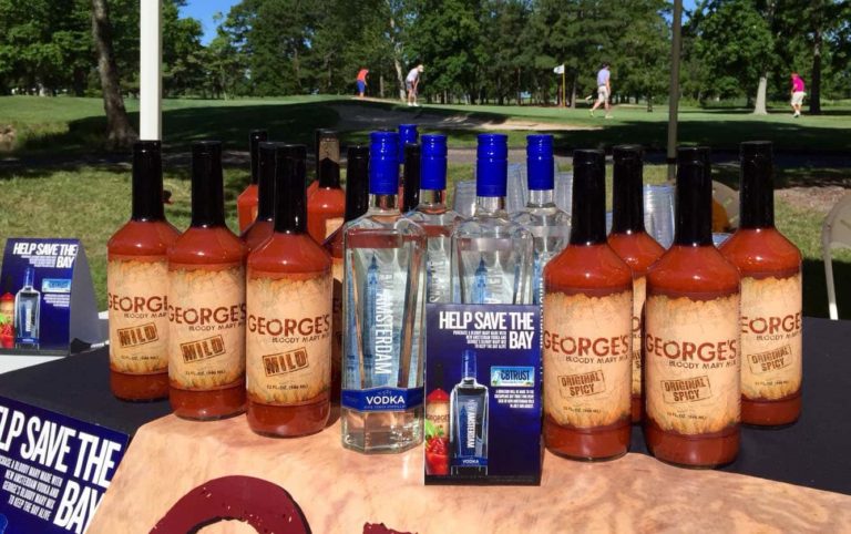 GEORGE’S® Bloody Mary Mix and New Amsterdam Vodka's Help Save the Bay table display next to golf course