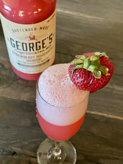 GEORGE’S® Strawberry Bellini served with strawberry garnish