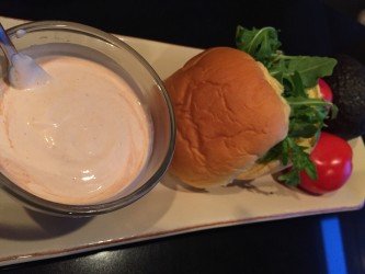 bowl of GEORGE’S® Bloody Mary Mayo served on plate with rolls and vegetables