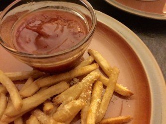 GEORGE’S® Bloody Mary Ketchup in dipping sauce bowl on plate with french fries