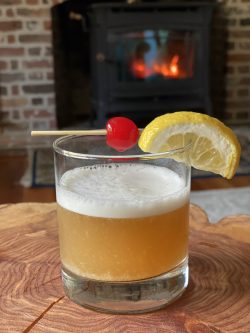 GEORGE’S® Amaretto Sour served with cocktail cherry and lemon slice garnish