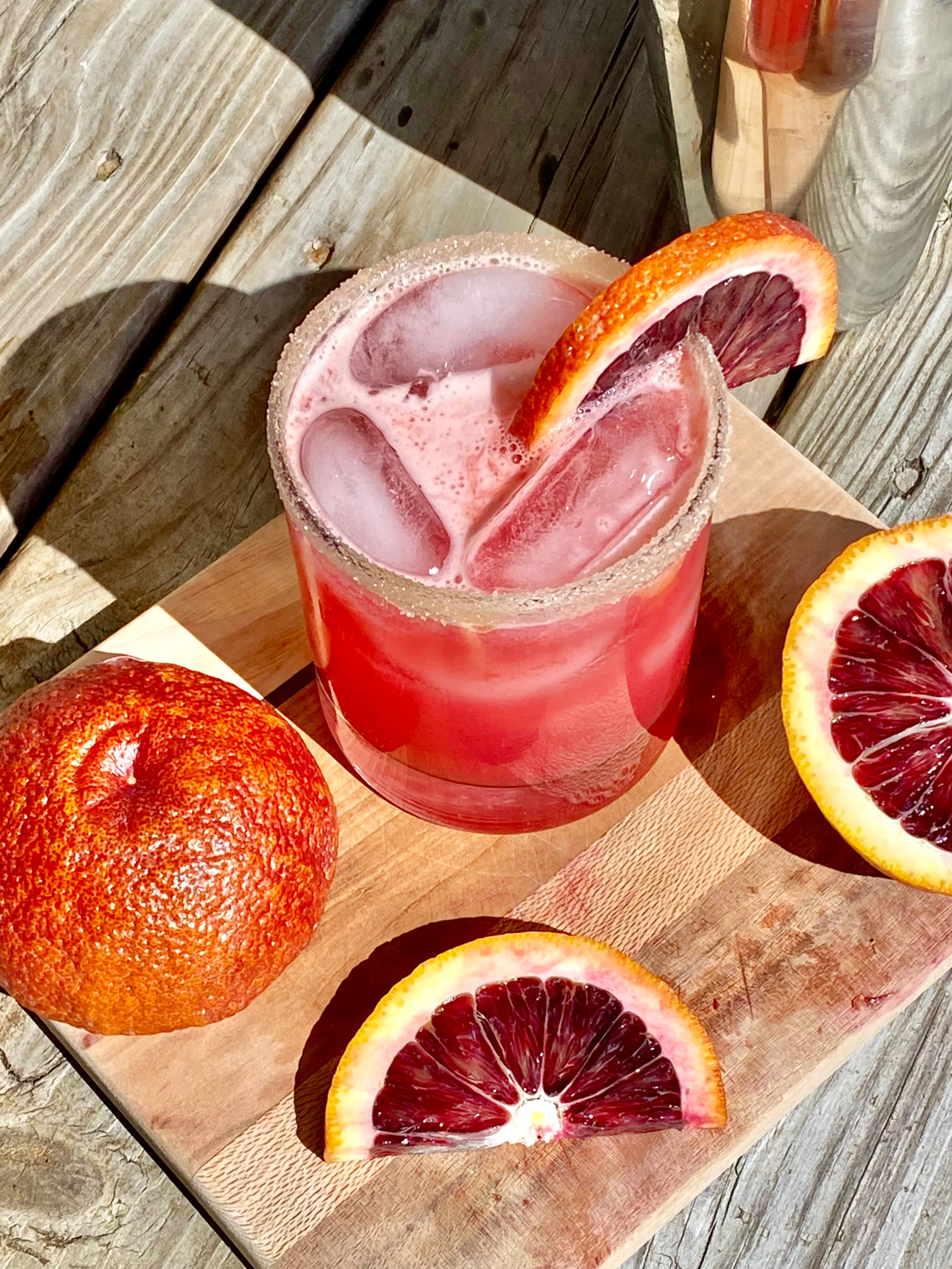 GEORGE’S® Blood Orange Margarita served in salt rimmed glass with blood orange slices