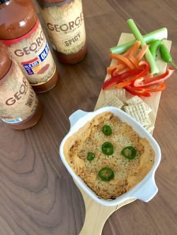 bowl of GEORGE’S® Jalapeño Popper Dip served on board with veggies and crackers