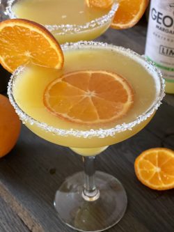 GEORGE’S® Orange Margarita served with orang slice garnish