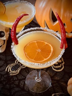 GEORGE’S® Halloween Margarita served in salt rimmed glass with 2 chili "horns"