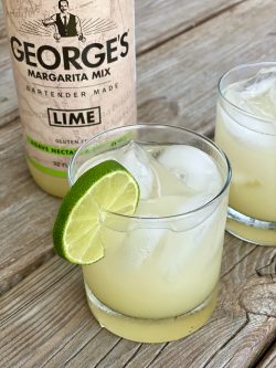 GEORGE’S® Coconut Cooler served with lemon slice garnish