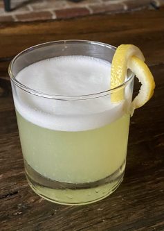 GEORGE’S® Gin Fizz served with lemon twist garnish