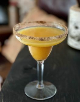 GEORGE’S® Pumpkin Margarita served in sugar and pumpkin pie spice rimmed glass