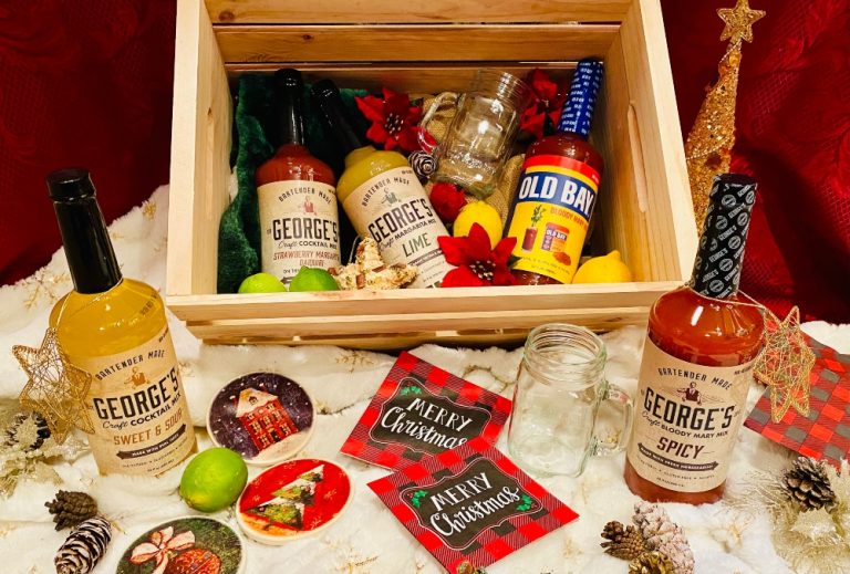 george's cocktail mixes in wooden crate on table with christmas decorations