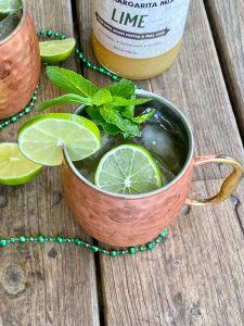 GEORGES Irish mule topped with mint and lime garnish, with GEORGES lime margarita mix