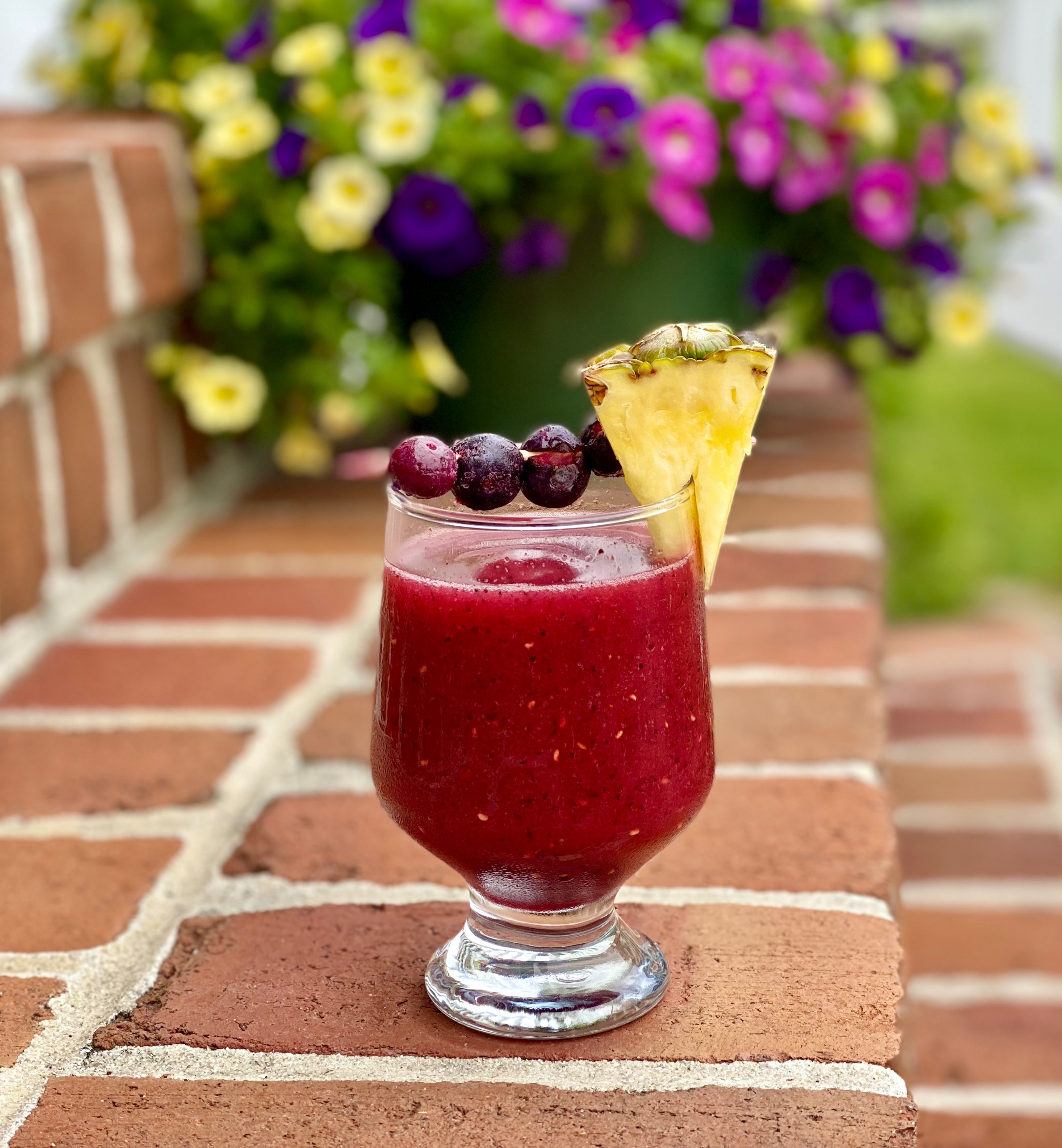 Rum cocktail with mixed berries and pina colada mix
