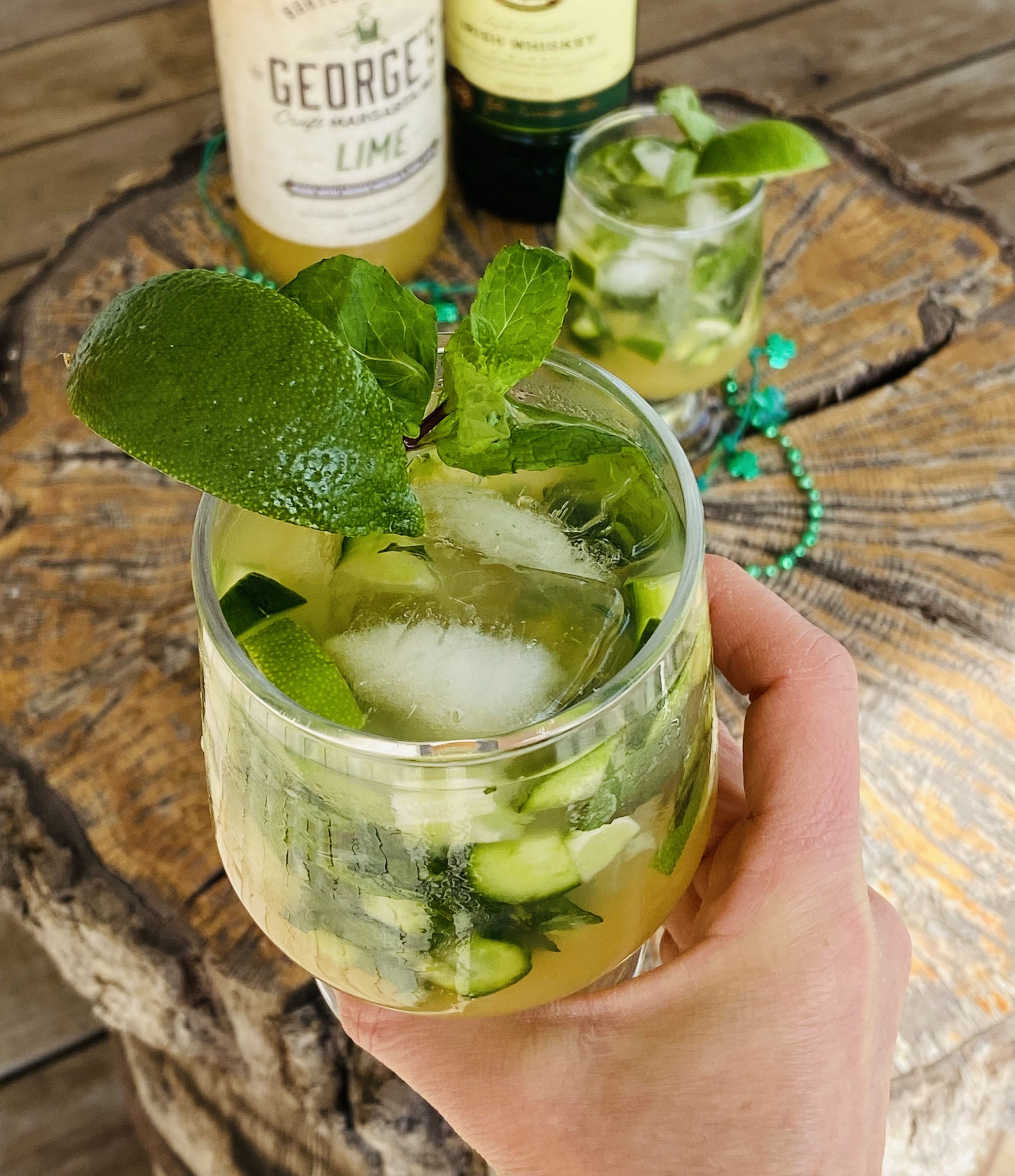 Irish cocktail with whiskey margarita mix mint and cucumbers