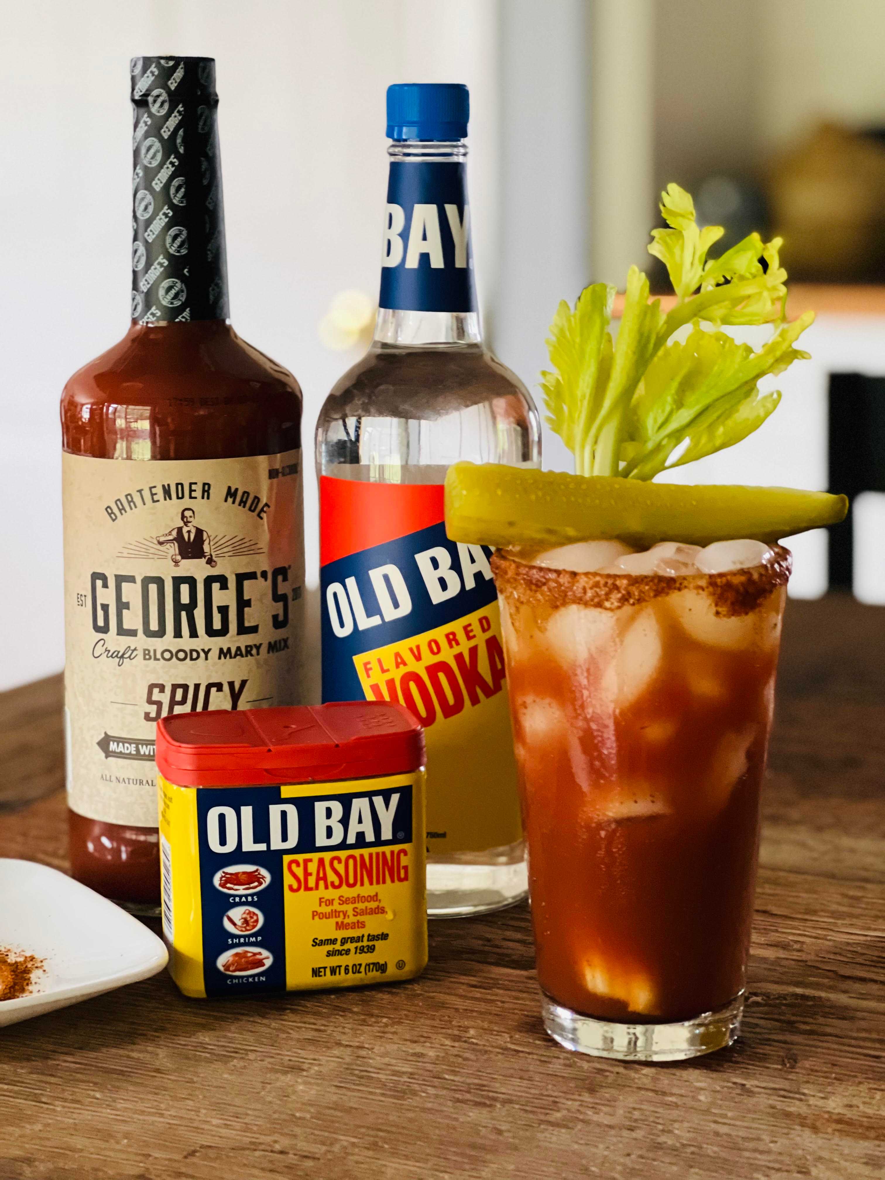 bloody mary cocktail mix and old bay vodka and seasoning on table